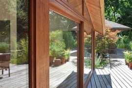 Sliding glass doors that connect the home with the deck outside