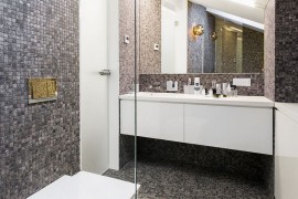 Small contemporary bathroom design with plenty of glam