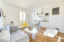 Small kitchen area in the corner with sleek workstation