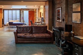 Smart home office and bedroom design separated by stackable doors