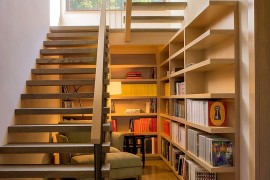 Space under the staircase is used as a reading nook