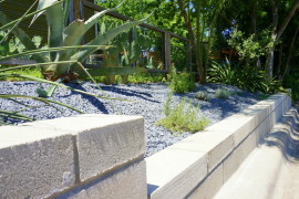 The retaining wall dips down to a lower level