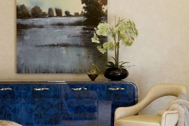Wall art and decor inside the master bedroom add to the cool color scheme