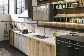 Wood, glass and metal shape the lovely Loft kitchen