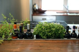 Awesome kitchen island combines the wine rack with herb garden