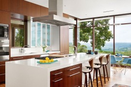 Beautiful modern kitchen of the Austin home with majestic views of the Bright Leaf preserve