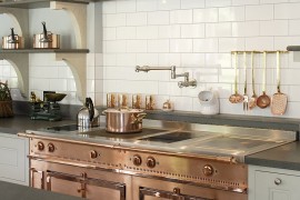 Custom copper and stainless steel La Cornue range in the bespoke kitchen