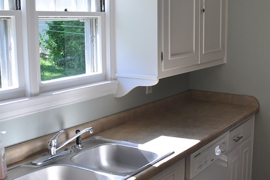DIY molding added to kitchen cabinets for $50