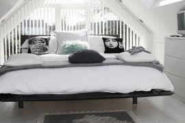 Dashing attic bedroom in black and white