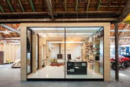 Exquisite office crafted from wood and glass with organized interior