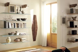 Floating glass bookcases give the room visual lightness