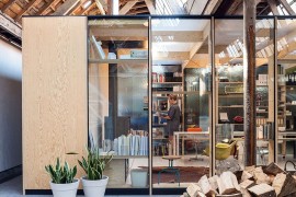 Frosted glass walls of the modern office inside old textile factory