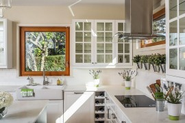 Herb pots also bring metallic glint to the kitchen