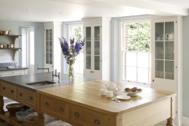 Island worktop split between oak and Italian basalt stone