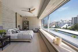 Master bedroom on the top floor with dramatic views of the city skyline