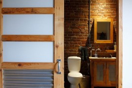 Perfect door for the industrial bathroom with slavaged style