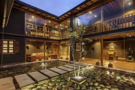 Stunning courtyard with reflective pond and river rock