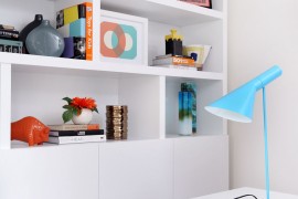 Turquoise Arne Jacobsen AJ table lamp on the work table