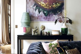 Bold wall art and curated collection of accessories set the mood inside this Paris home