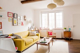 Bright yellow couch becomes the focal point in this smart living room [From: Jan Skacelik]