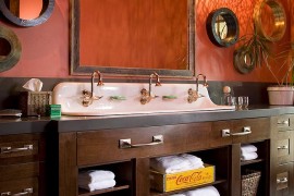 Brilliant pendants create visual magic in the rustic bathroom