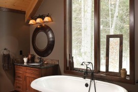 Clever blend of modern and rustic touches in the attic bathroom [Design: Riverbend Timber Framing]