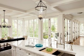 Coffered ceiling in a bright kitchen with marble countertops