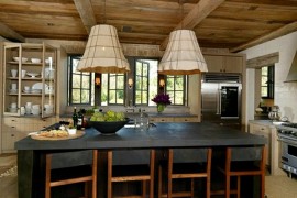 Dark kitchen island adds elegance to the rustic kitchen