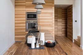 Concrete pendants bring textural contrast to the contemporary interior [Design: Charles Virone Concept]