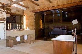 Contemporary and rustic styles meet inside this Austrian bathroom