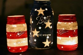 DIY Painted Red White and Blue Mason Jars Lit Up at Night