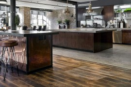 Expansive industrial kitchen in the loft home [Design: Siberian Floors]