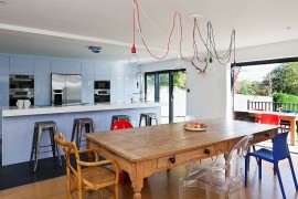 Exposed filament bulb pendants are a hot trend in the lighting world [Design: Boutique Homes]