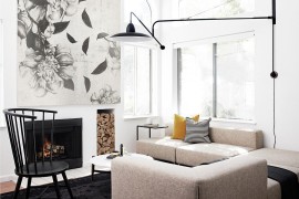 Exquisite living room in black and white with a fireplace [Design: Studio Revolution]