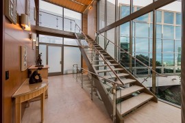 Extensive use of windows opens up the home to the ocean outside