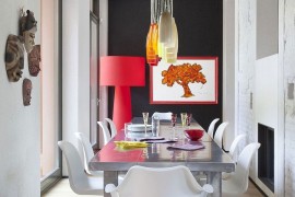 Formal dining area gets a colorful, fun twist inside this eclectic Italian home