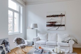 Herringbone pattern flooring stands out in the white living room [From: Sven Fennema - Living Pictures]