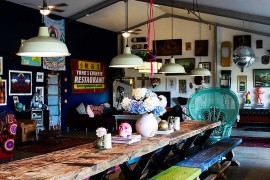 Industrial lighting and Lady Peacock chair steals the show in this dining room [Design: Alida And Miller]