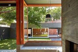 Large glass windows connect the interior with the landscape outside