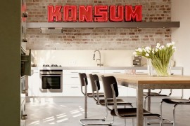 Make a statement with illuminated signs in the industrial kitchen! [Design: Eilmann Architekt]