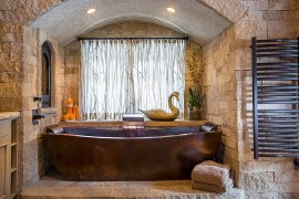 Metal and stone bring a serene spa-style to the bathroom [Design: Diamond Spas]