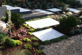 Metal edging meets gravel in this stunning outdoor space