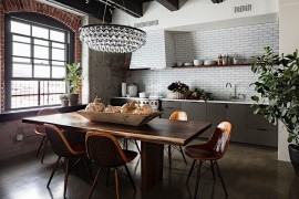 Modern chandelier brings glam to the industrial setting [Design: Jessica Helgerson Interior Design]