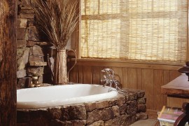 Moss rock around the bathtub makes a cool style statement [Design: Greenauer Design Group]