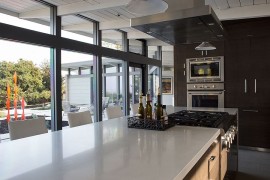 Open and airy kitchen design with stylish glass walls