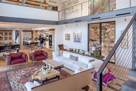 Open plan living area crafted in metal and glass