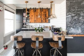 Reclaimed wood, bar stools, lighting and chalkboard paint give the kitchen great textural contrast