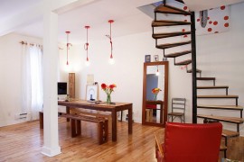 Red pendants from CB2 bring understated industrial charm to the modern kitchen [Design: Esther Hershcovich]