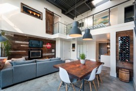 Rugged-chic pendant lights blend in with the contemporary loft style