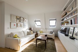 Small Scandinavian style living room with sleek shelves and natural lighting [Design: Philippe Demougeot]